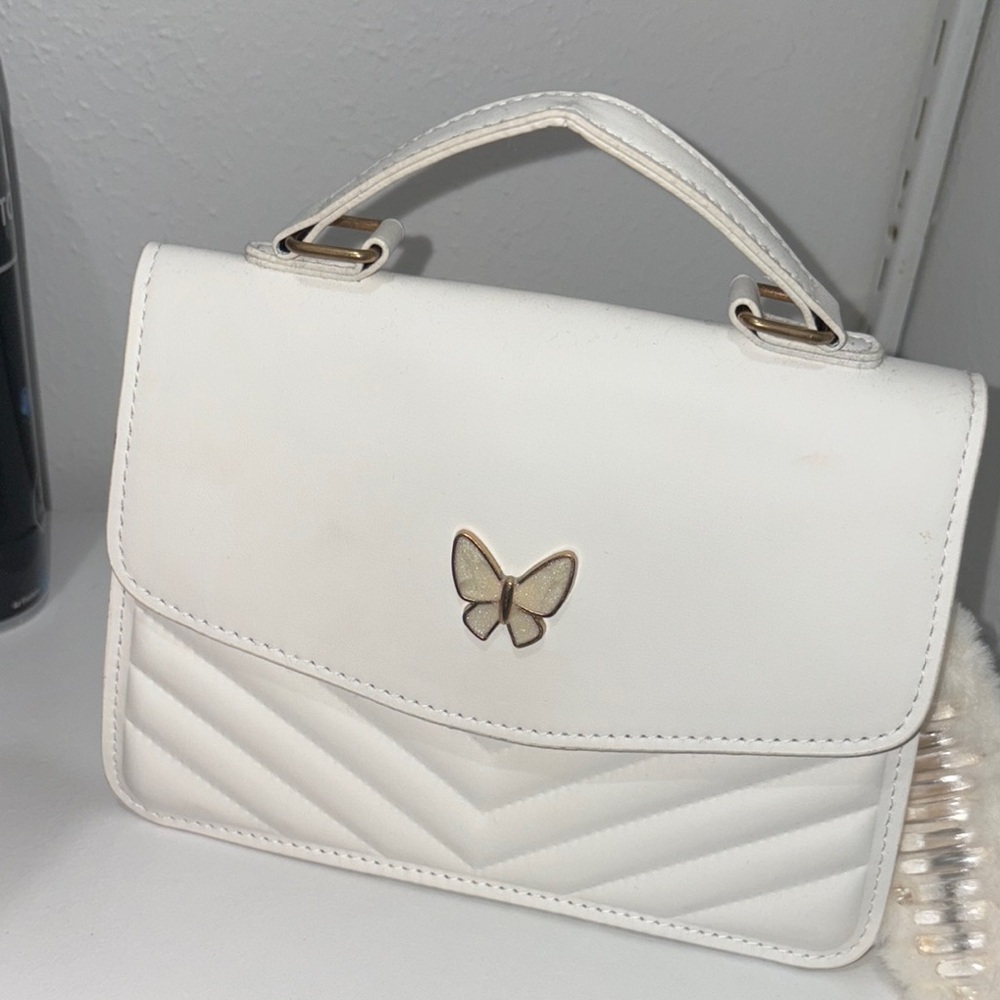 Elegant White Handbag with Butterfly Accent